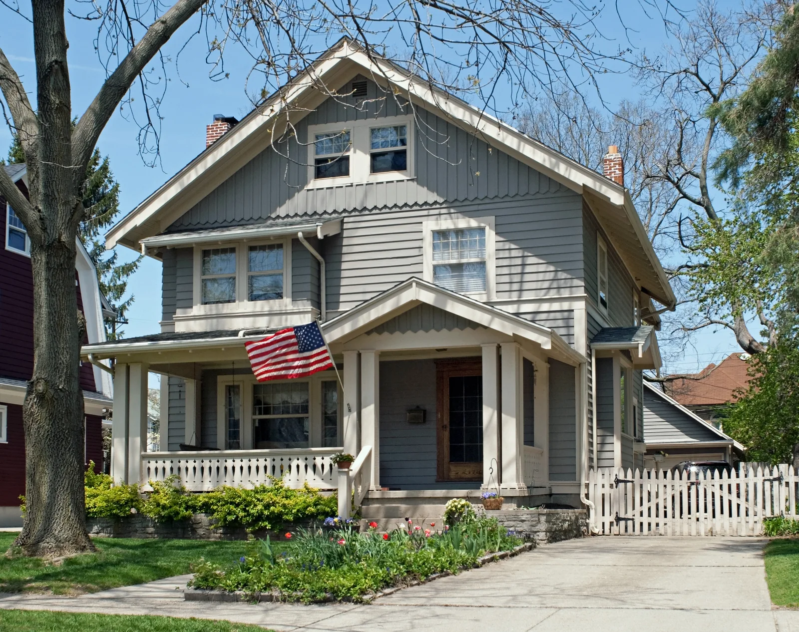 Classic American home with a front porch and an American flag